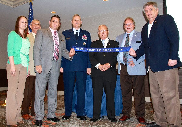 Chapter members—including some of the oldest and youngest members—celebrate the chapter’s 4th consecutive Model Chapter of the Year Award in May. Accepting the award are (l-r) Samantha Goggans, Gen. Charlie Bishop, USAF, Bill Robinson, Col. Richard Lipsey, USAF, Bart Bartlett, Tom Allen and Kelley Crooks.